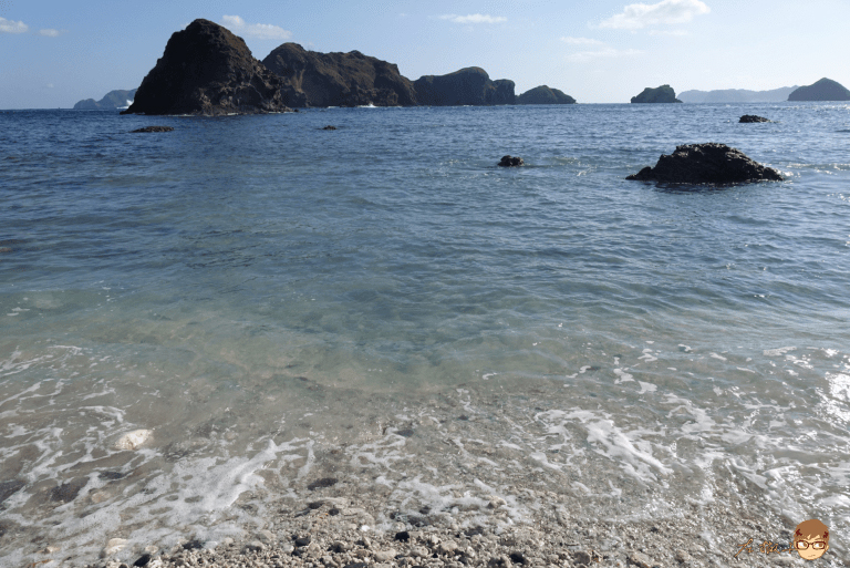 A rare sight of a black sand beach.