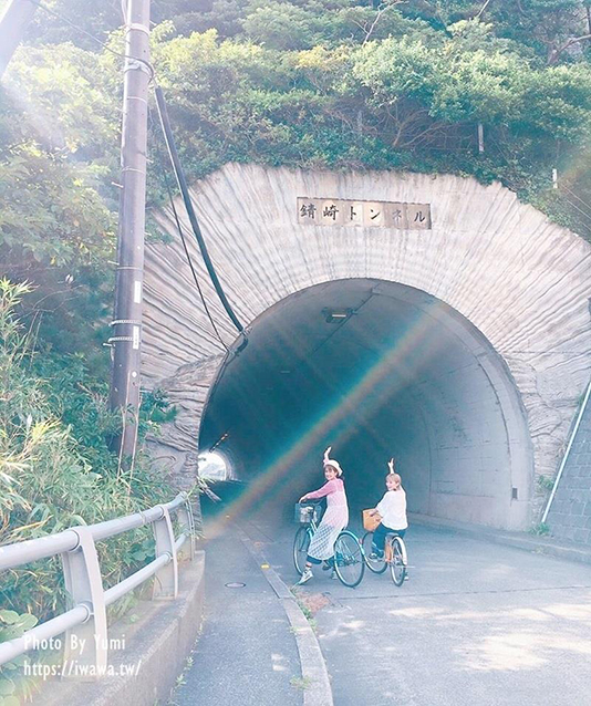 Riding a bicycle while enjoying the scenery.